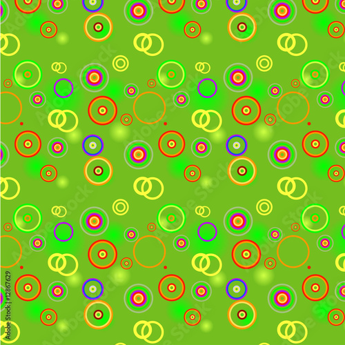 Bright green background with color spots, circles and rings