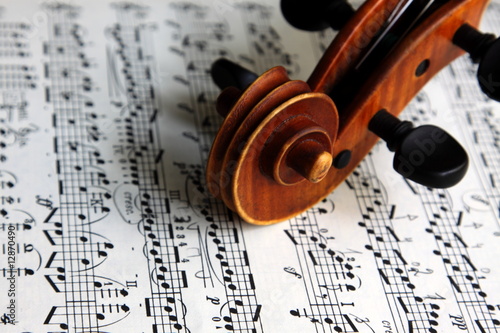 violin scroll on sheet music