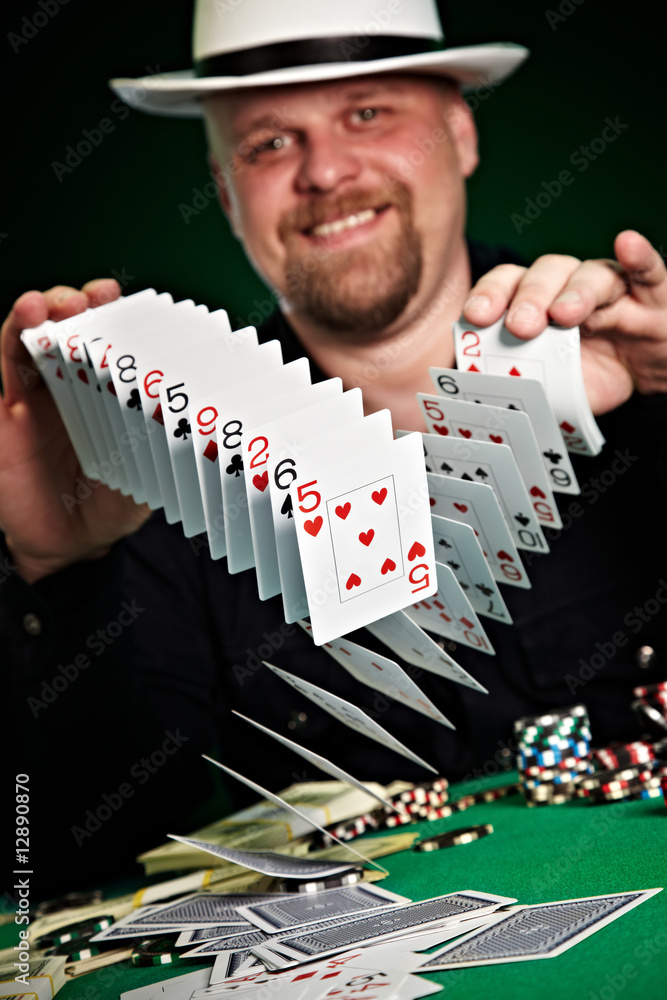 man skilfully shuffles playing cards man skilfully shuffles playing cards