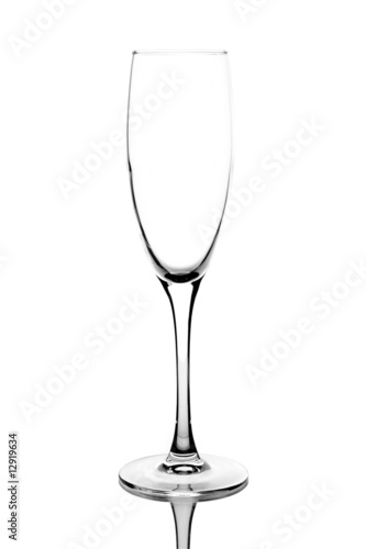 Closeup of empty champagne glass on white background