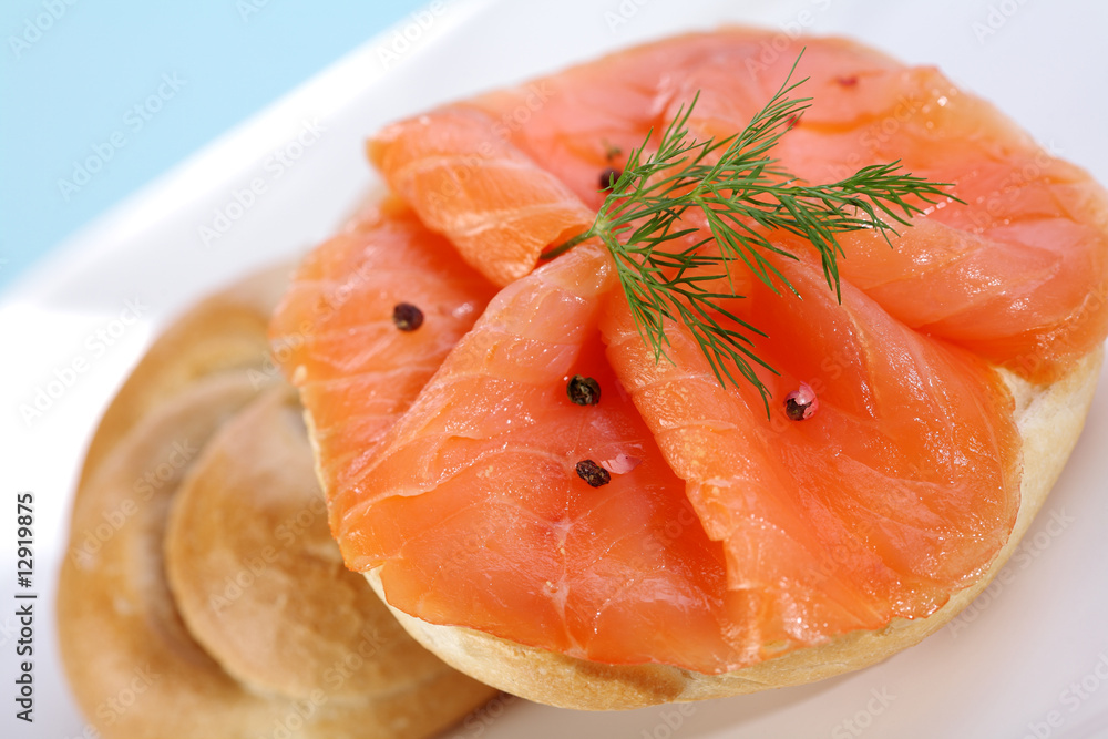 Smoke salmon on bagel with freshly black pepper. Smoke salmon on bagel with freshly black pepper.