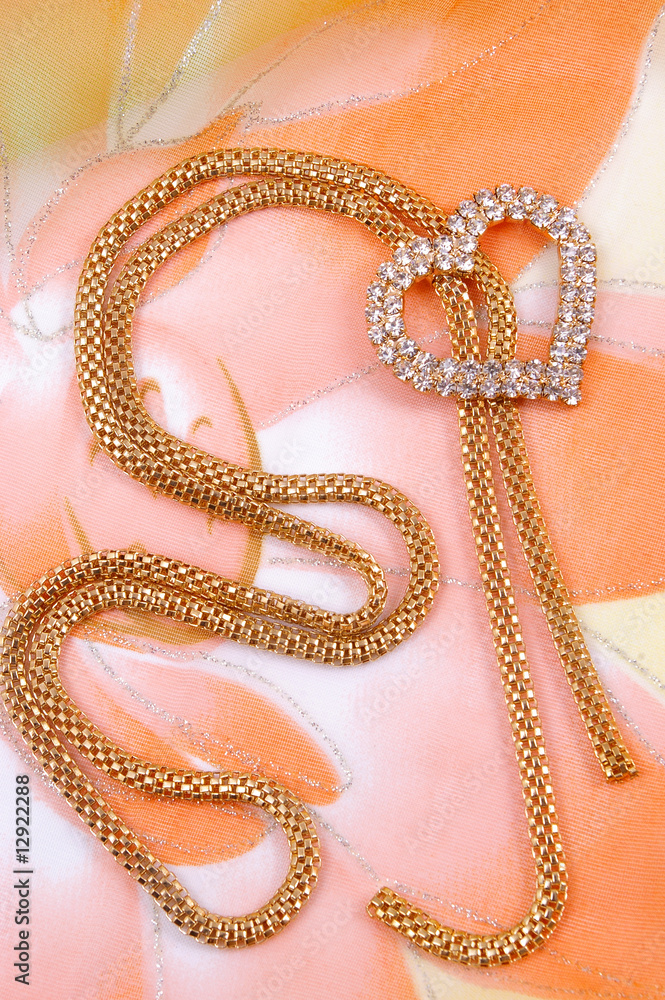 Jewelry with heart on background silk fabrics Jewelry with heart on background silk fabrics