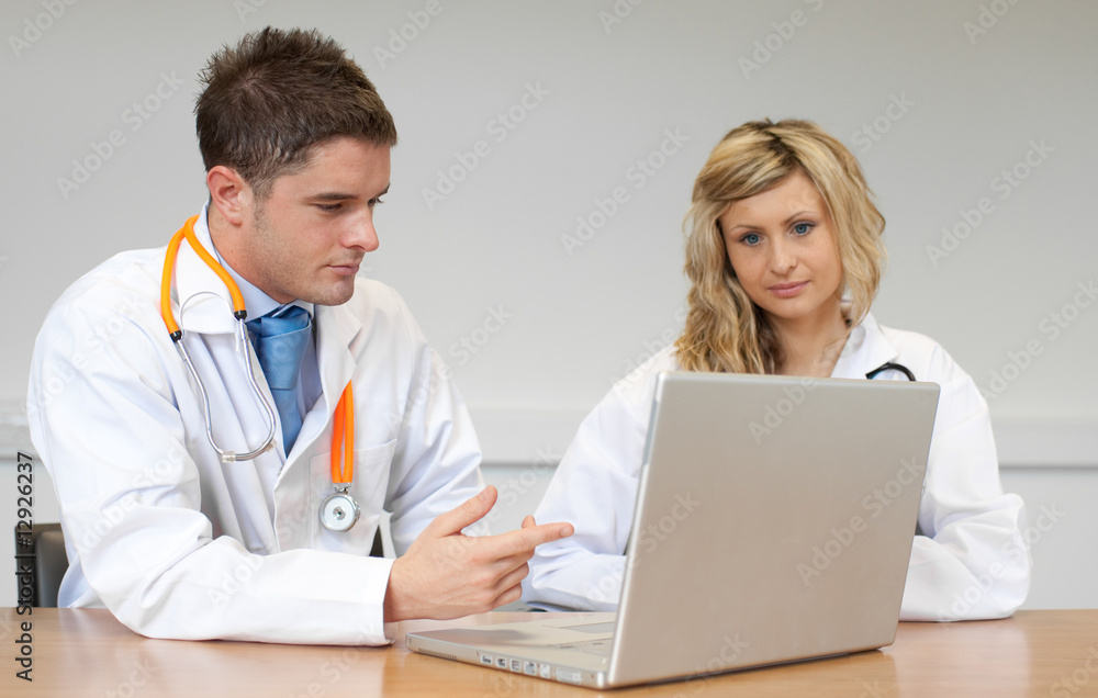 Two doctors with a laptop Two doctors with a laptop