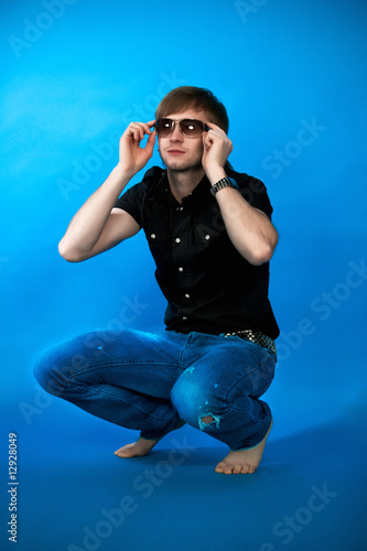 man sitting on his hunkers free pose looking up photo