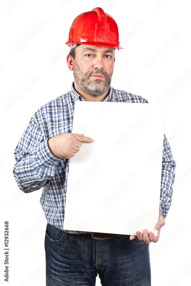 Construction worker showing a placard Construction worker showing a placard
