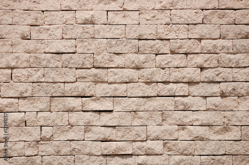 Fragment of rough gravel brick wall