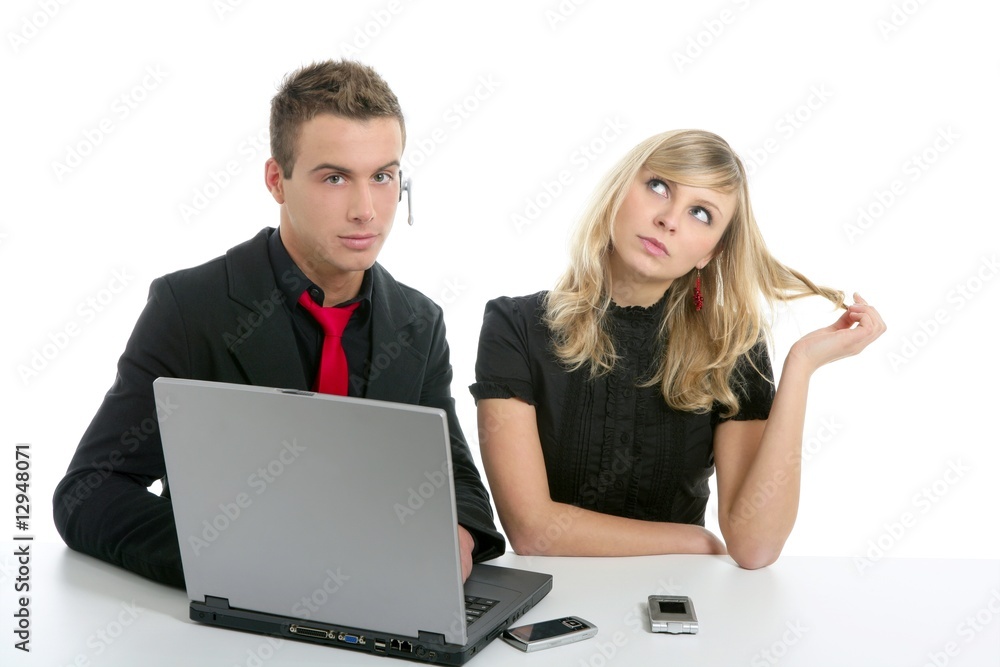 Young business couple laptop isolated on white Young business couple laptop isolated on white