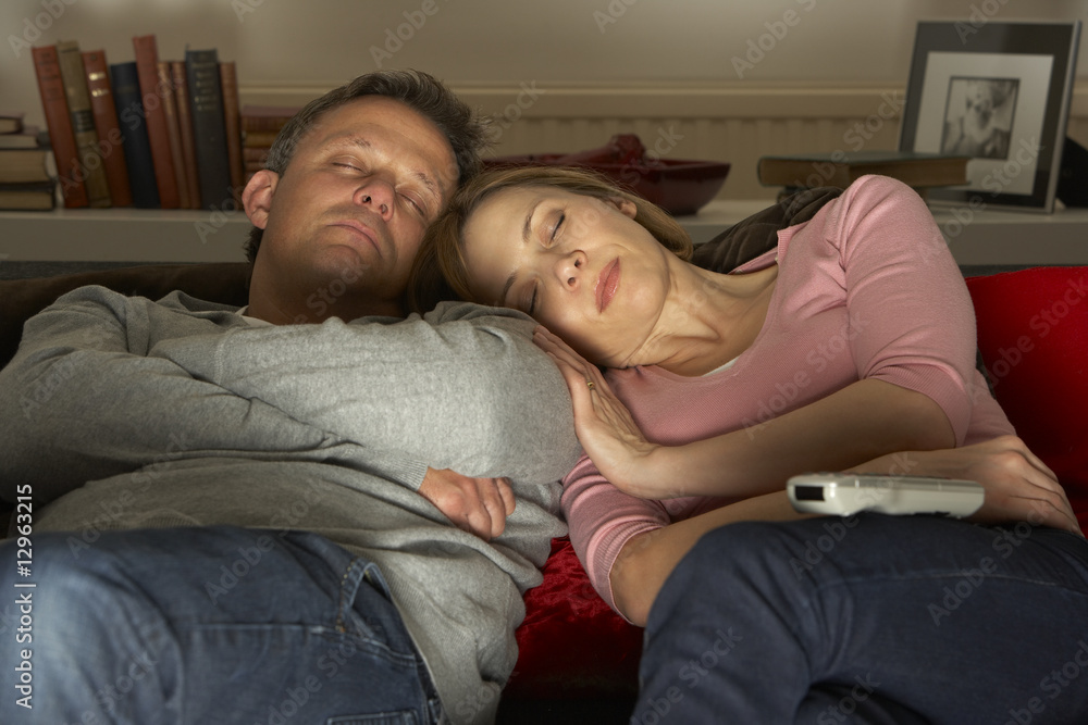 Couple Asleep In Front Of Television Couple Asleep In Front Of Television