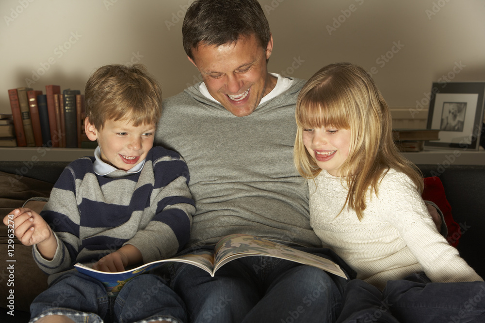 Father And Two Children Reading Father And Two Children Reading