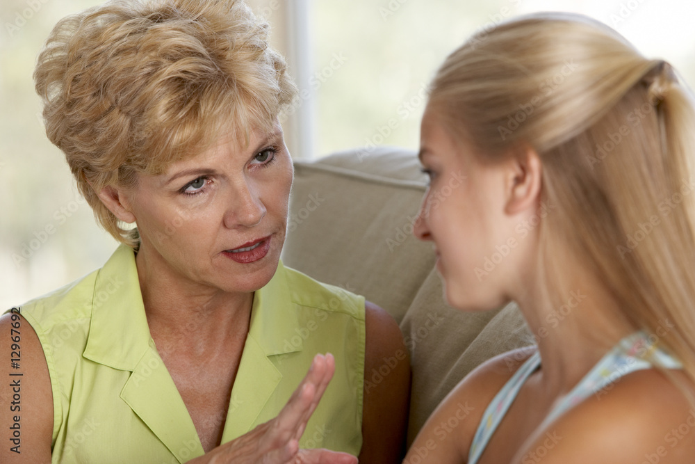 Woman Having A Serious Talk With Her Daughter Woman Having A Serious Talk With Her Daughter