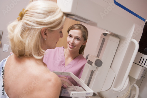 Nurse Assisting Patient Undergoing Mammogram photo