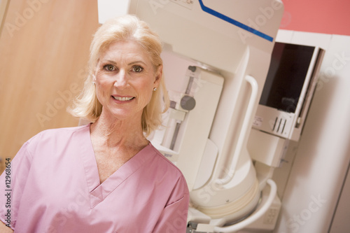 Portrait Of A Nurse In Front Of A Mammogram Machine