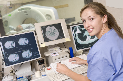 Nurse Monitoring Patient Having A Computerized Axial Tomography