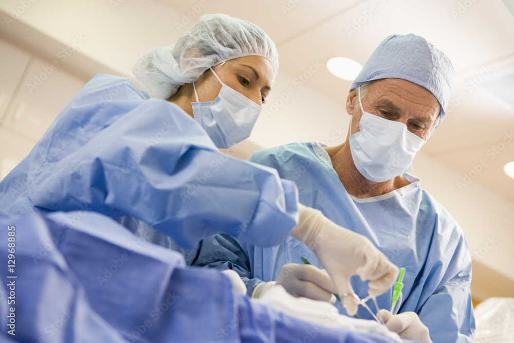 Surgeons Operating On Patient Surgeons Operating On Patient