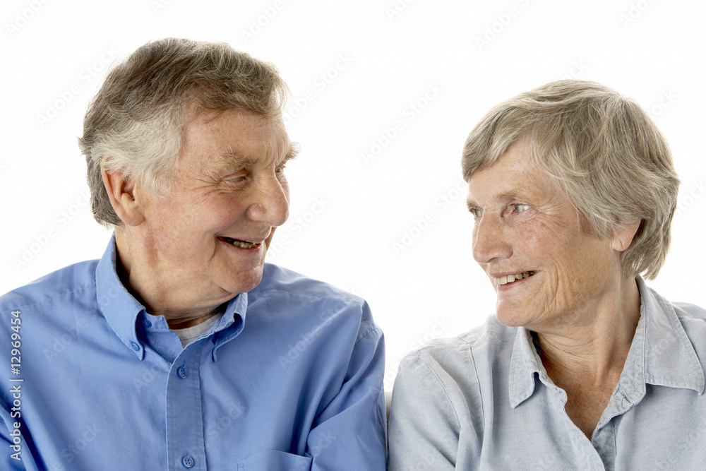 Portrait of senior couple smiling at each other Portrait of senior couple smiling at each other