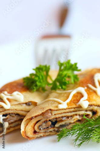 Pancake with fried mushroom