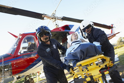 Paramedics unloading patient from Medevac photo