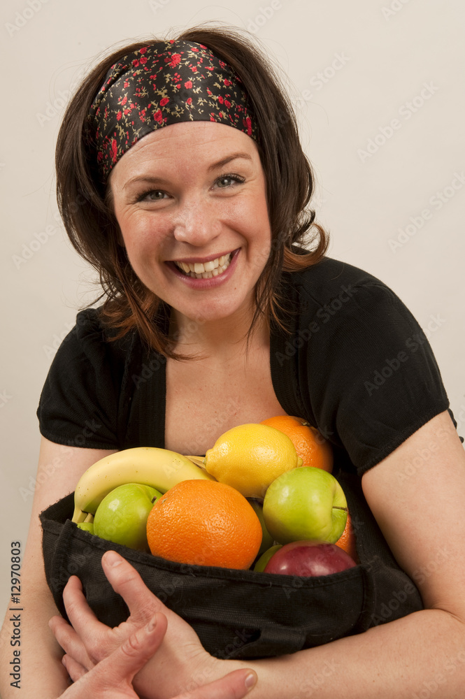 Girl holding a fruit basket