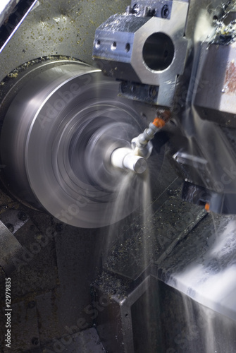 CNC lathe running with coolant