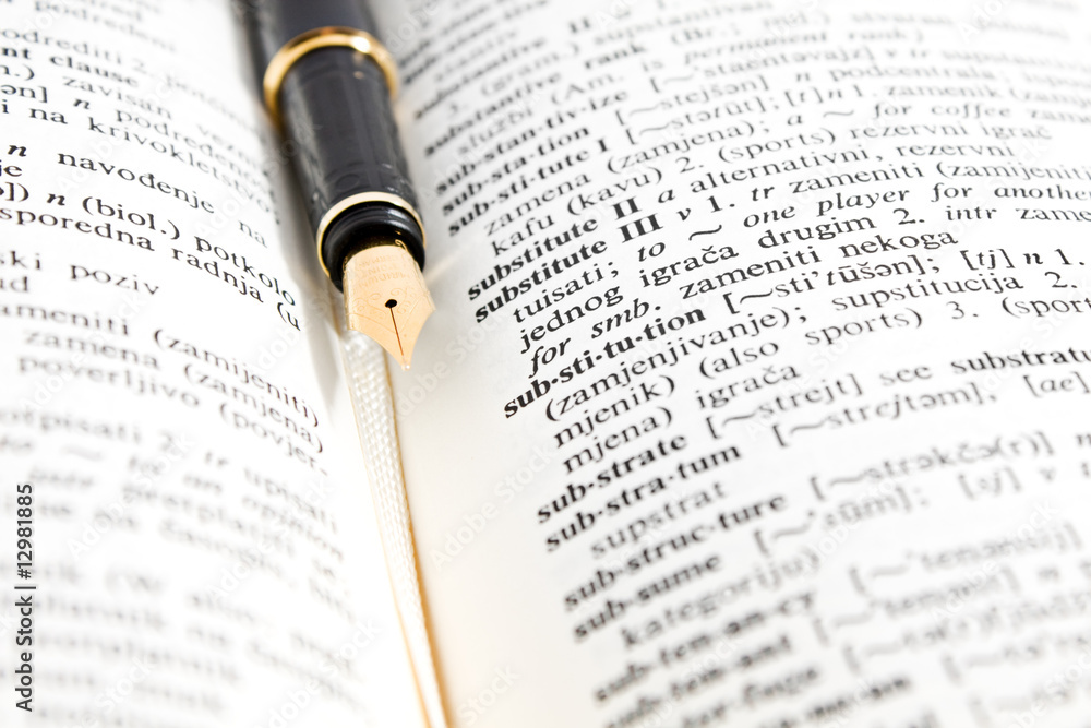 fountain pen and dictionary book showing success fountain pen and dictionary book showing success