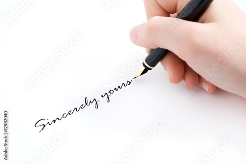 hand and fountain pen writting sincerely yours text