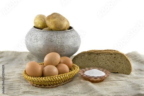 Still-life from vegetarian food. Fresh cucumbers  eggs lying in