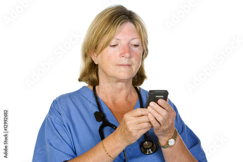 Senior Female Doctor Checking Pager on White Background photo