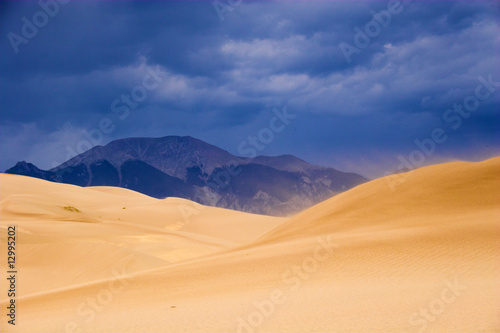 Thunderstorm over sand dunes