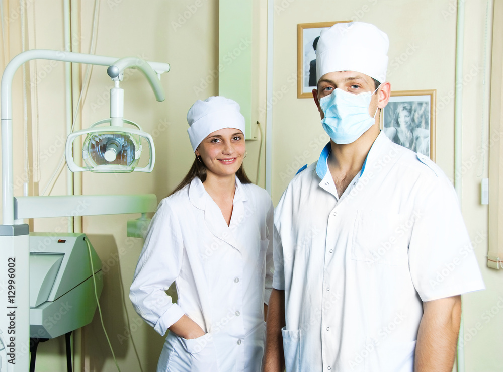 dentist and assistant in the office dentist and assistant in the office