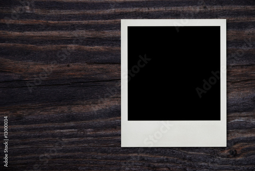 blank vintage photo frame on wood background