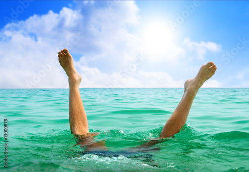 man jumping in ocean