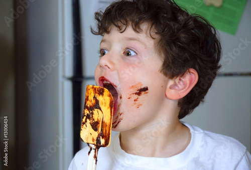 Boy licking Brownie dough