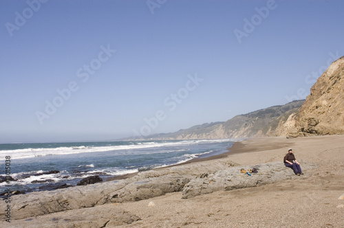 Woman on rugged beach