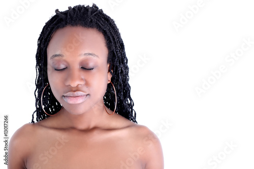 young afro-american woman with closed eyes isolated on white