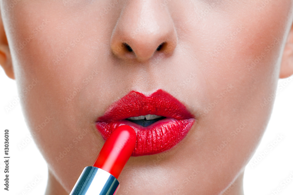 Naklejka premium Applying lipstick