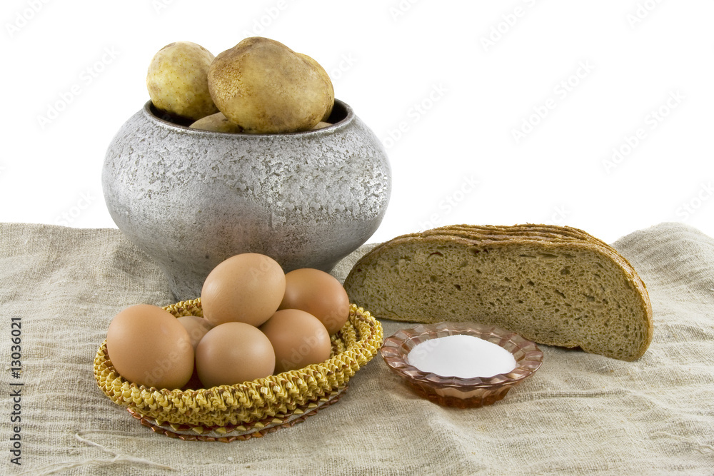 Still-life from vegetarian food. Fresh eggs lying in a wattled s Still-life from vegetarian food. Fresh eggs lying in a wattled s