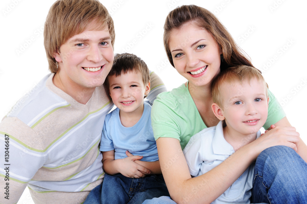 happy young family with two little sons