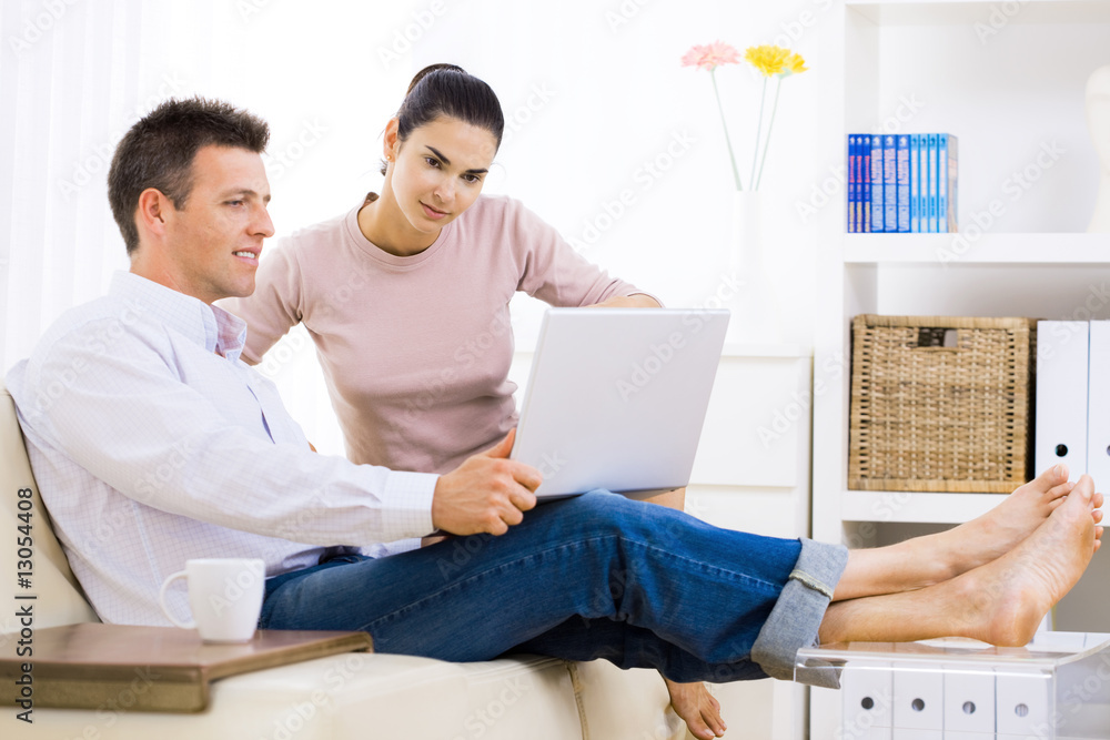 Couple using laptop computer Couple using laptop computer