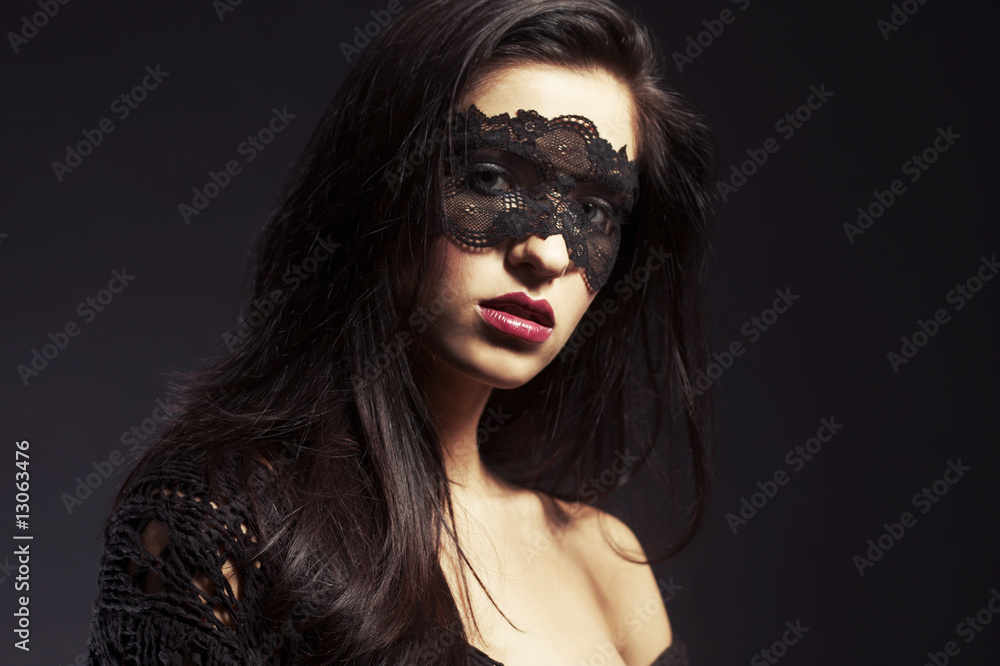 woman dressed in mourning clothes, face partially covered woman dressed in mourning clothes, face partially covered