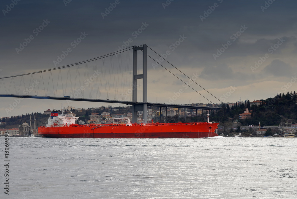 ship under Bosphorus bridge before the storm