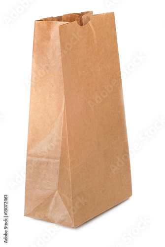 Brown paper bag over white background