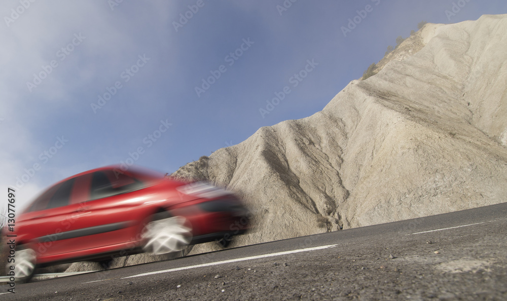 Naklejka premium Red car on a road