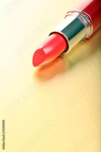 red lipstick on golden background