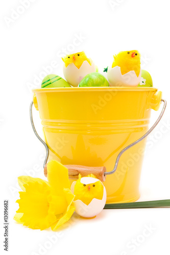 colorful easter eggs in bucket isolated on white