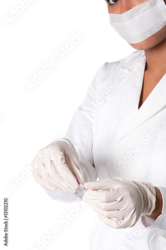 Beautifull Indonesian nurse with stripp of pills photo