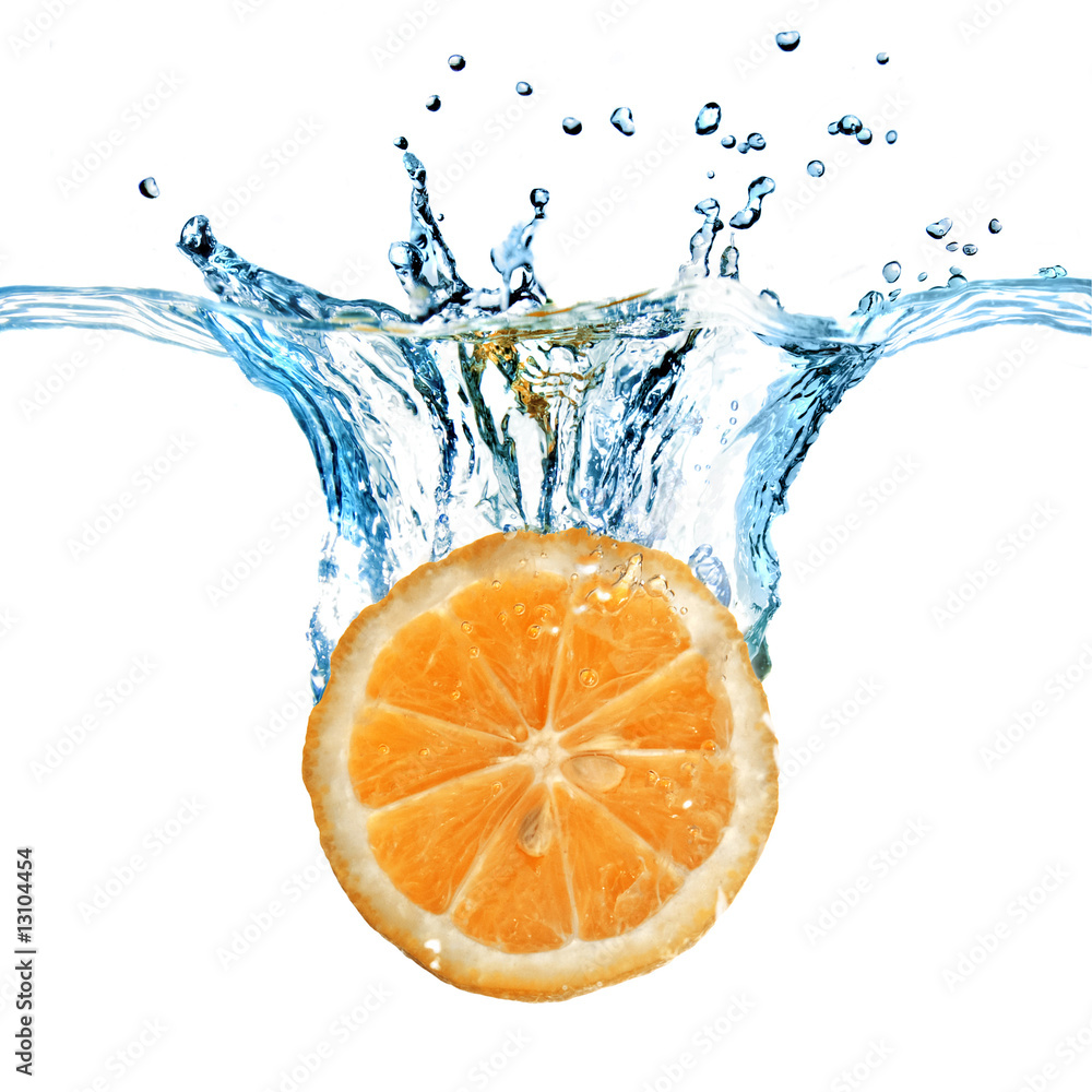 Fresh lemon dropped into water with splash isolated on white Fresh lemon dropped into water with splash isolated on white