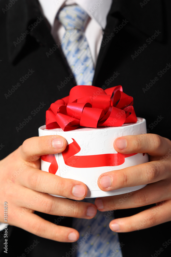 Businessman with gift box in hands Businessman with gift box in hands