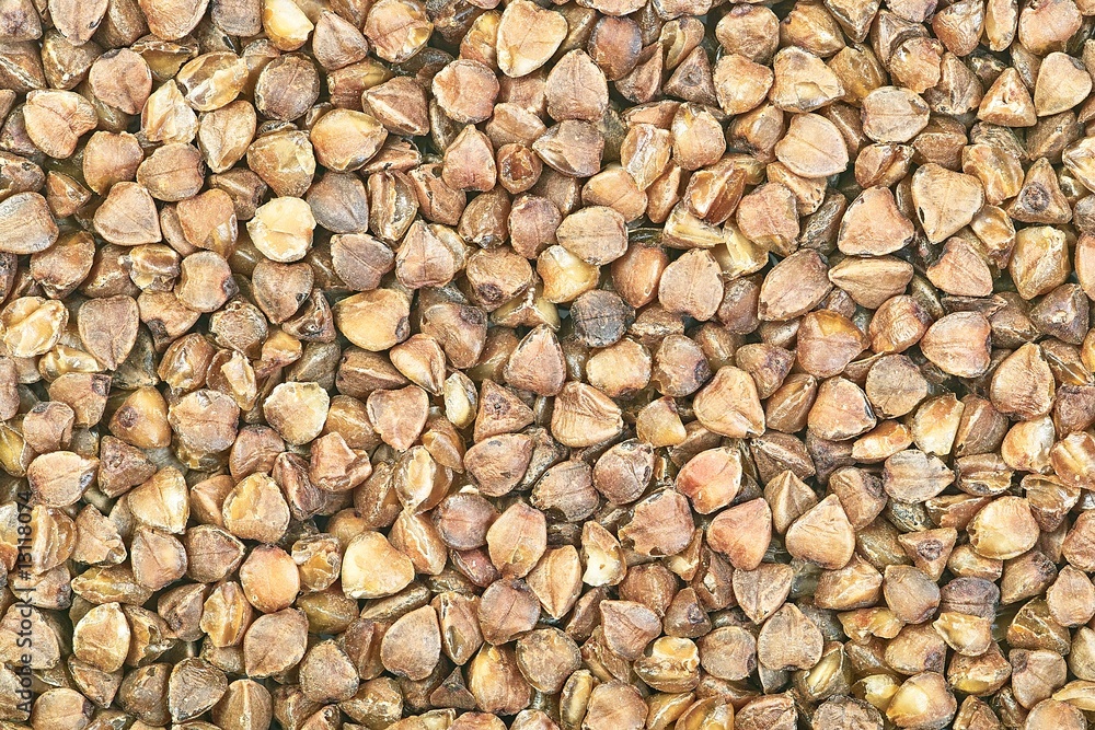 Raw buckwheat seeds macro background pattern texture Raw buckwheat seeds macro background pattern texture
