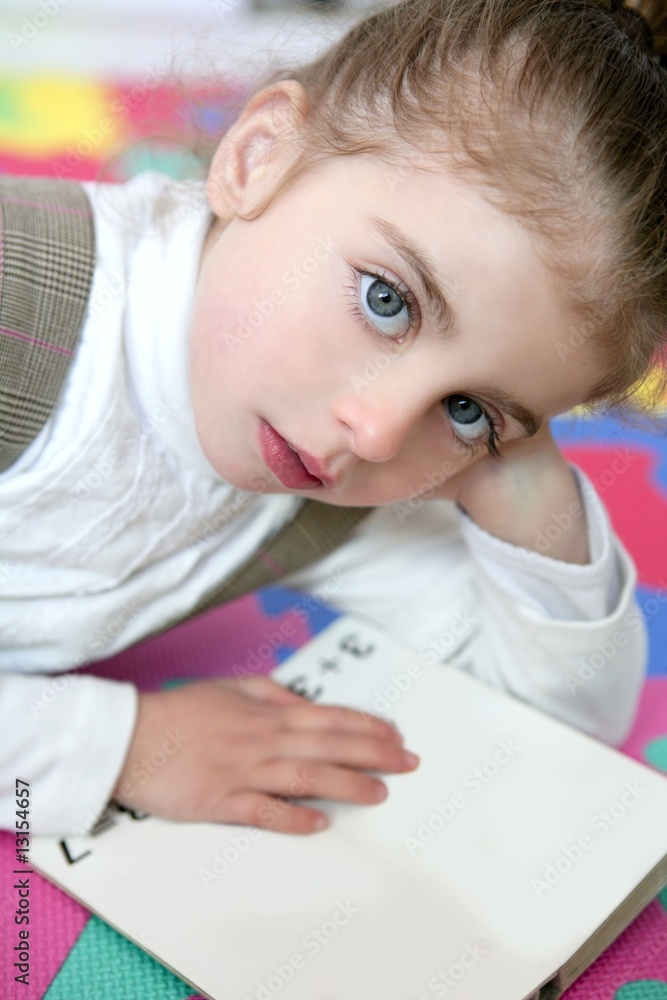Beautiful preschooler girl studying book Beautiful preschooler girl studying book