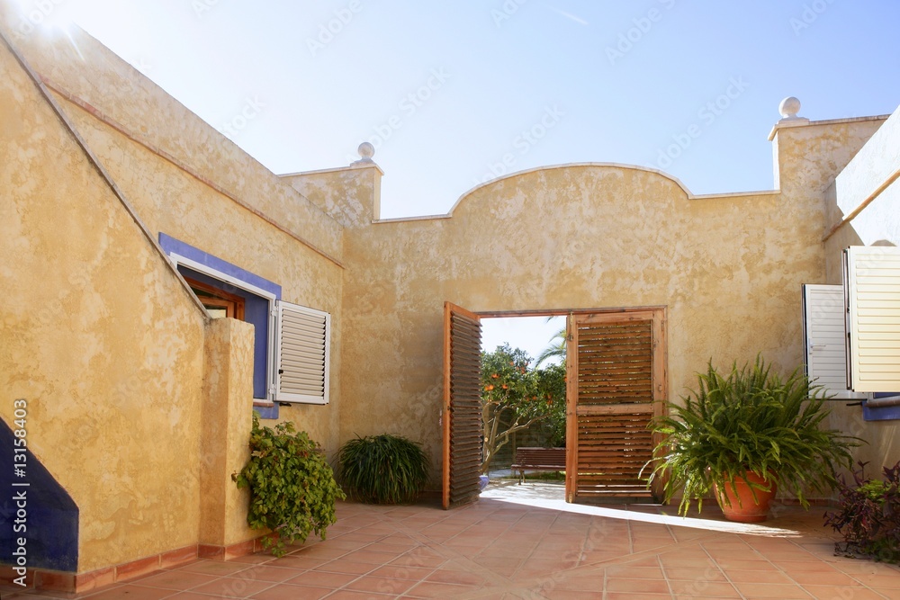 Naklejka premium Spanish golden mediterranean courtyard house